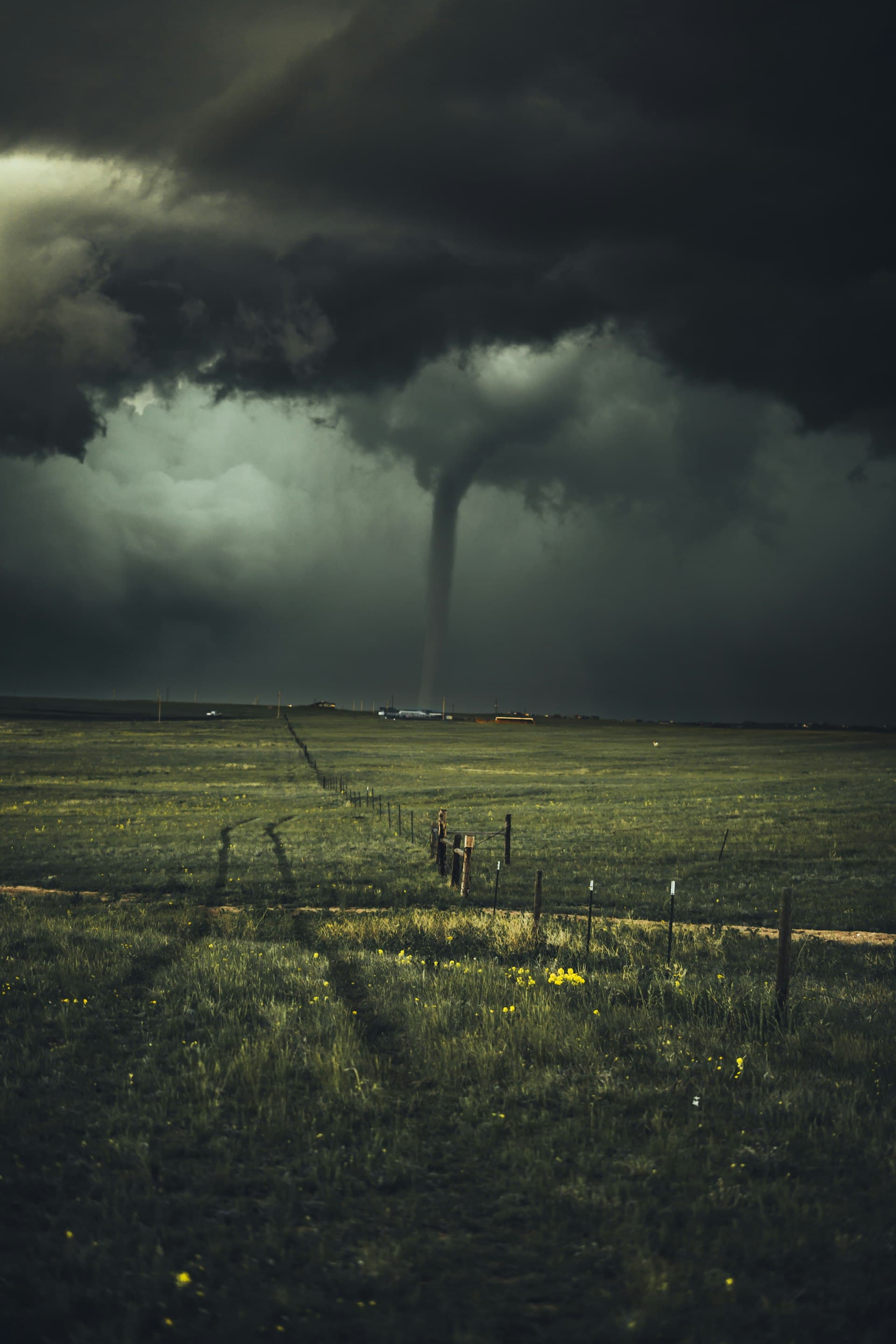 Severe storm and tornado over open landscape